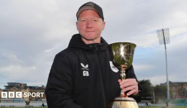 Gareth Batty in Surrey hoodie holding the County Championship trophy