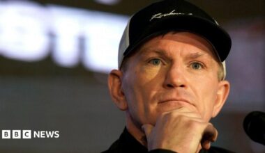 A headshot image of Ricky Hatton, wearing a black and white cap, at a pre-fight boxing press conference