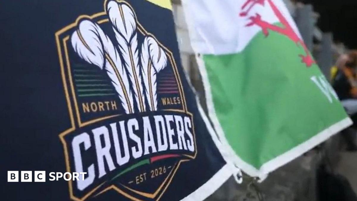 North Wales Crusaders flag alongside Welsh dragon flag
