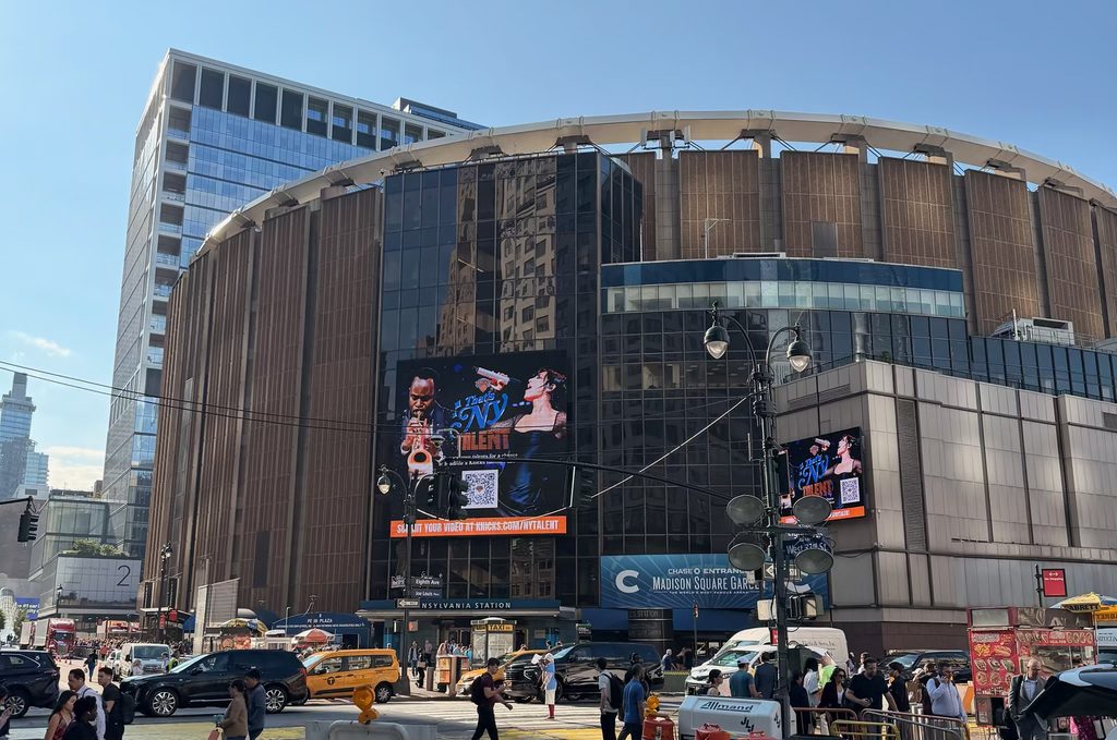 Madison Square Garden’s Eighth Avenue exterior with the NY Talent display and street-level taxis