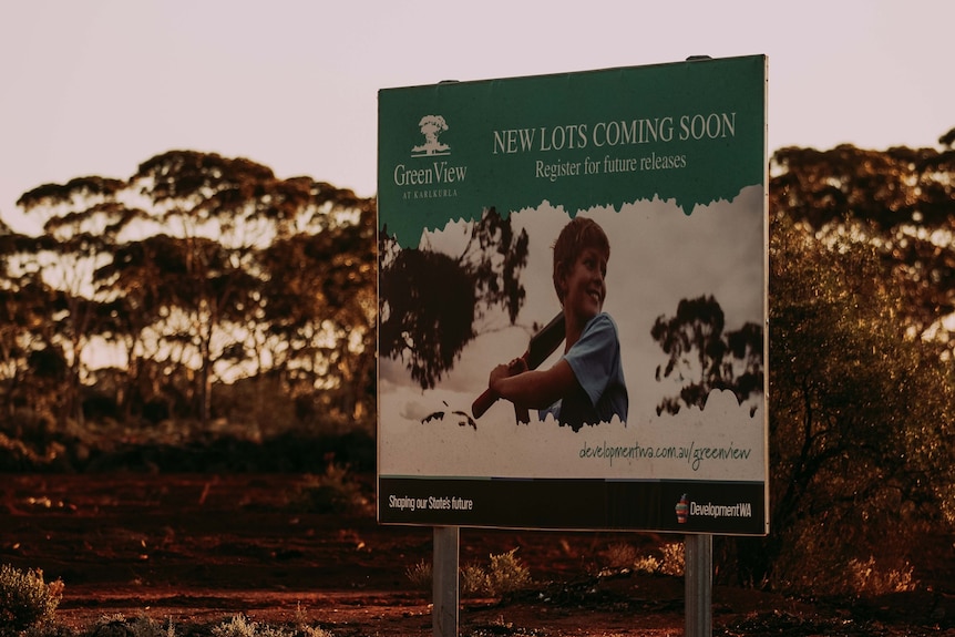 A real estate poster for residential land selling in bushland near Kalgoorlie.