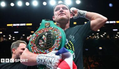 Dalton Smith has the WBC light-welterweight title on his shoulder and is holding up his arm