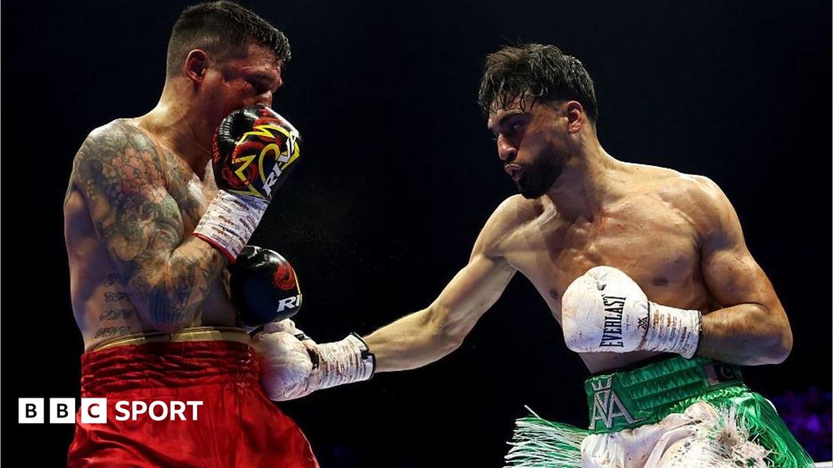 Adam Azim lands a punch on Steve Claggett