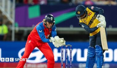 England wicketkeeper Amy Jones catches the ball as Sri Lanka batter Malki Madara plays and misses in a T20 World Cup match in 2024