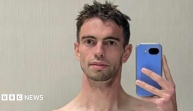 Selfie of a man holding up his phone.