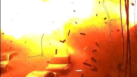 Huge explosion captured on CCTV after deadly strike hits grocery store in Kharkiv – video