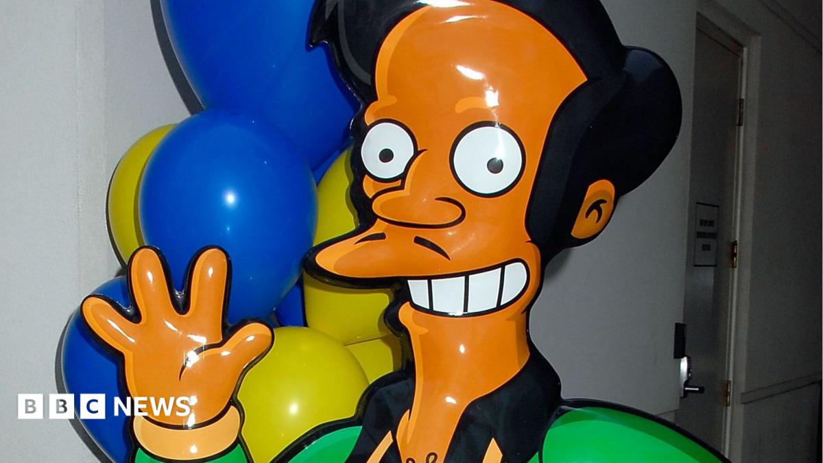 A mocked-up life size version of the Simpsons character Apu, seen smiling and waving. Picture taken in 2007