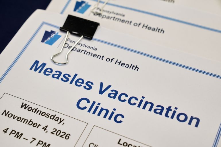 A flyer is displayed at a Pennsylvania Department of Health measles vaccination clinic located in Lancaster County in Peach Bottom, Pa., Tuesday, Oct. 20, 2026. (AP Photo/Matt Rourke)