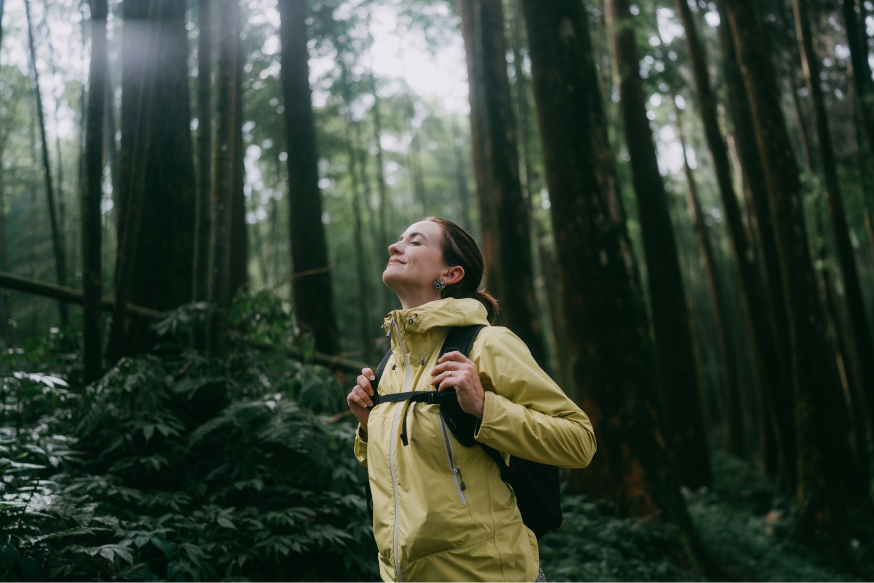 A woman walking through the forest