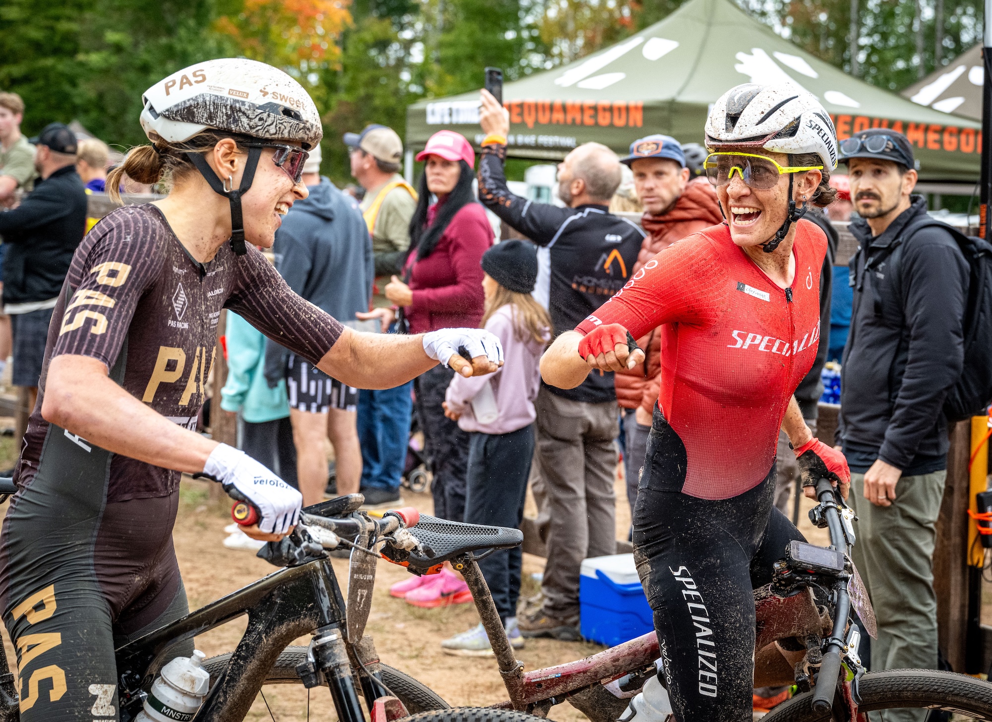 Sofia Gomez Villafa&ntilde;e (right) extended her lead in the 2026 Life Time Grand Prix standings with the win at Chequamegon MTB, congratulating race runner-up Karolina Migoń, who was fourth in the Grand Prix