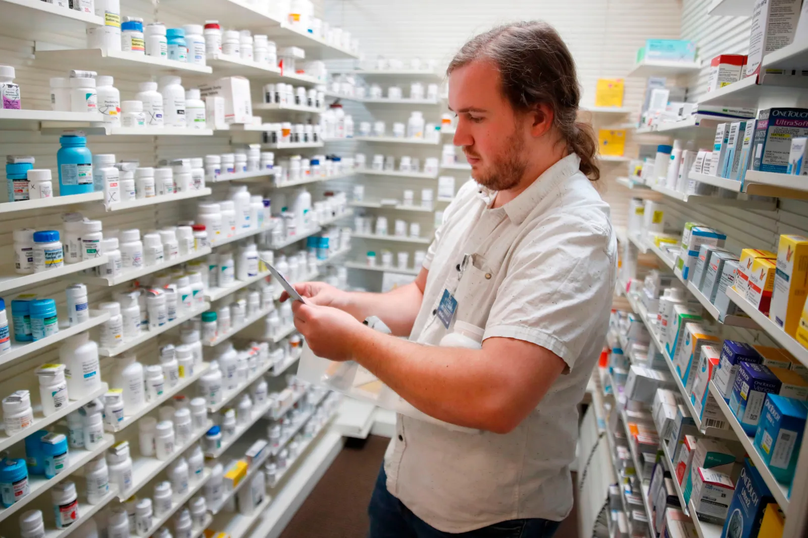 File photo: a pharmacy tech fills prescriptions at Rock Canyon Pharmacy in Provo, Utah, on May 20, 2020.