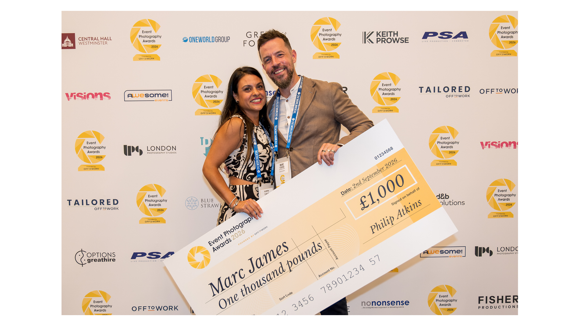 Photographer Marc James receiving his prize for Event Photographer of the Year at the Event Photography Awards 2026 ceremony, pictured with his wife.
