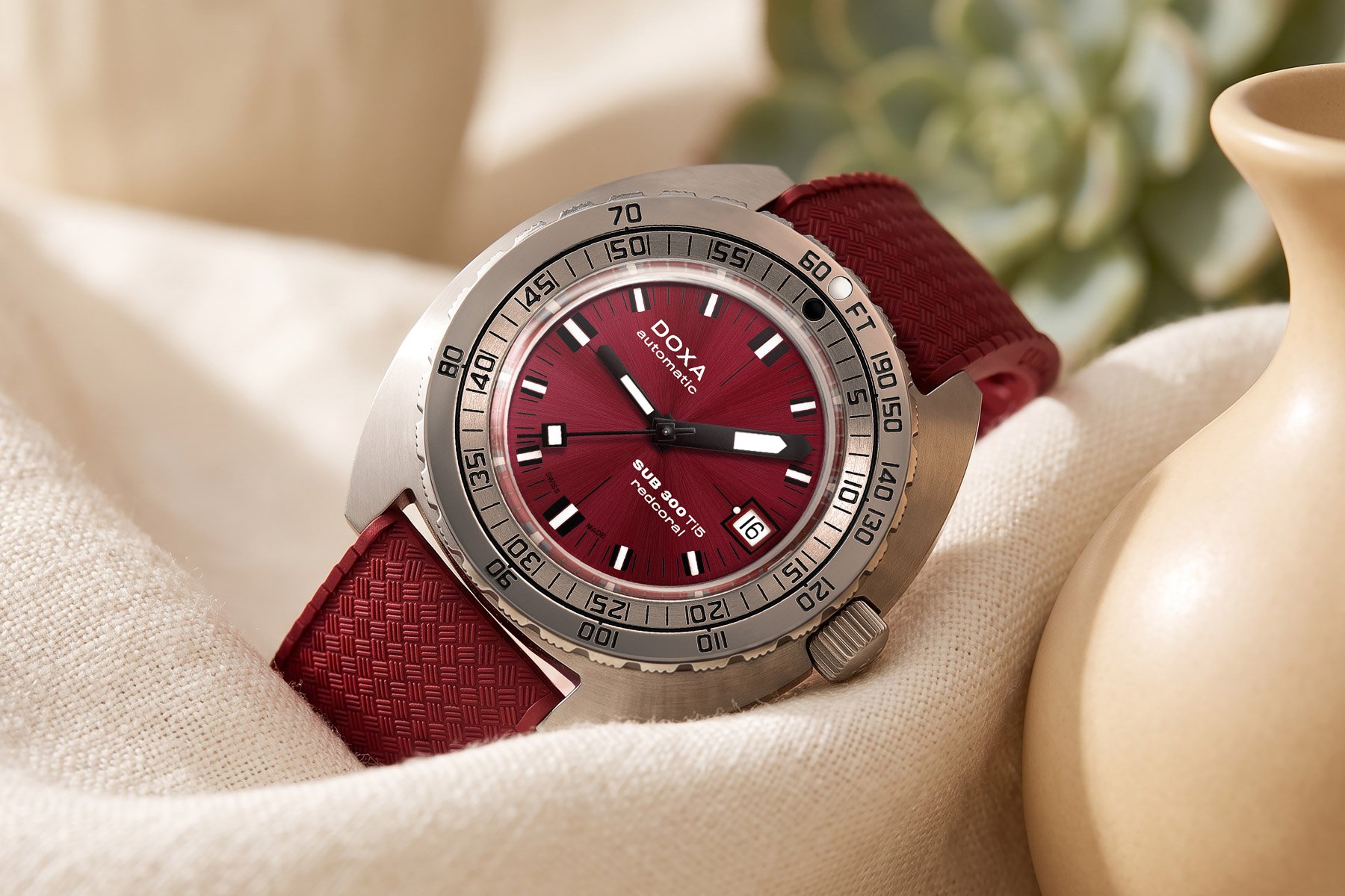 Doxa Sub 300 Ti5 Red Coral on its side