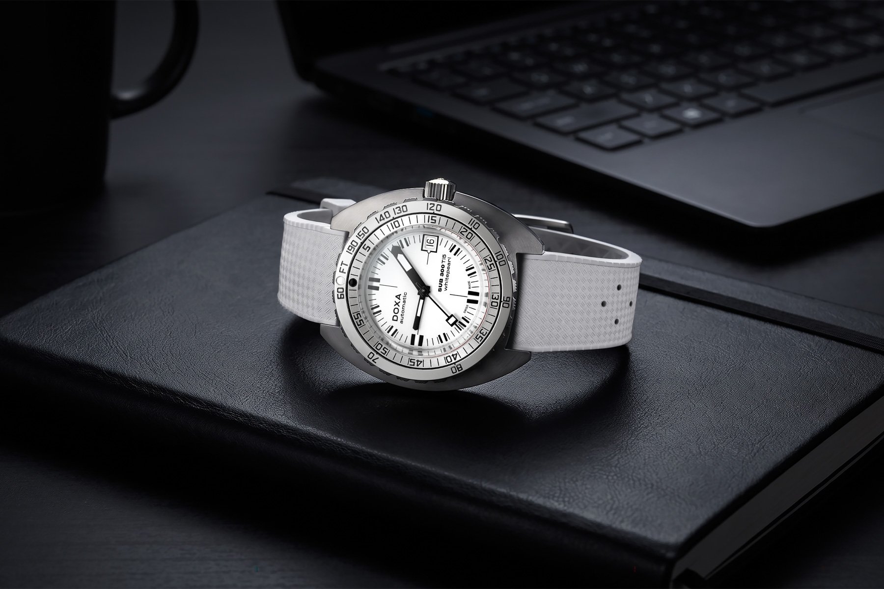 Doxa Sub 300 Ti5 WhitePearl on its side, crown up