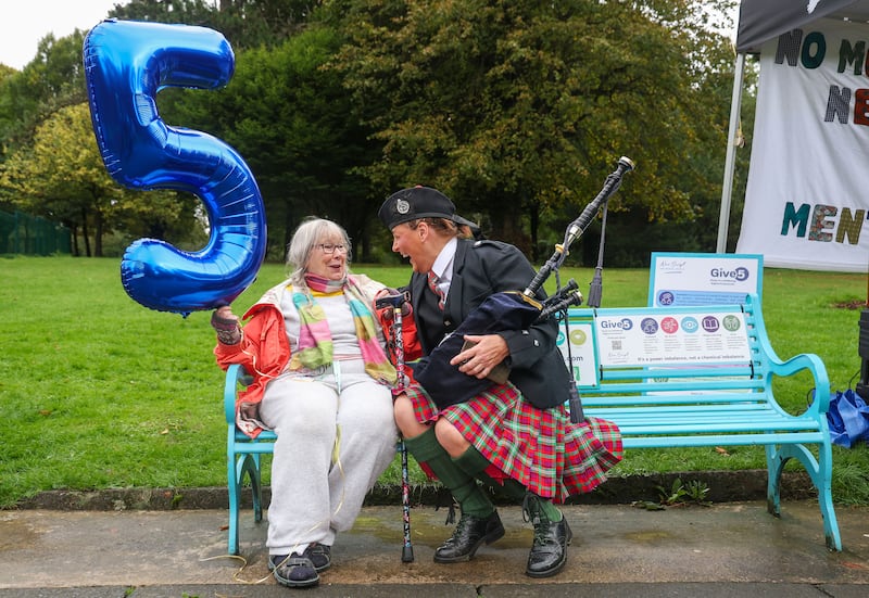 Maura Campbell and Piper Regina Pendleton at the unveiling of New Script for Mental Health’s new Give 5 installation bench in the Falls Park in west Belfast as part of Féile na Carraige 2026. PICTURE: MAL MCCANN
