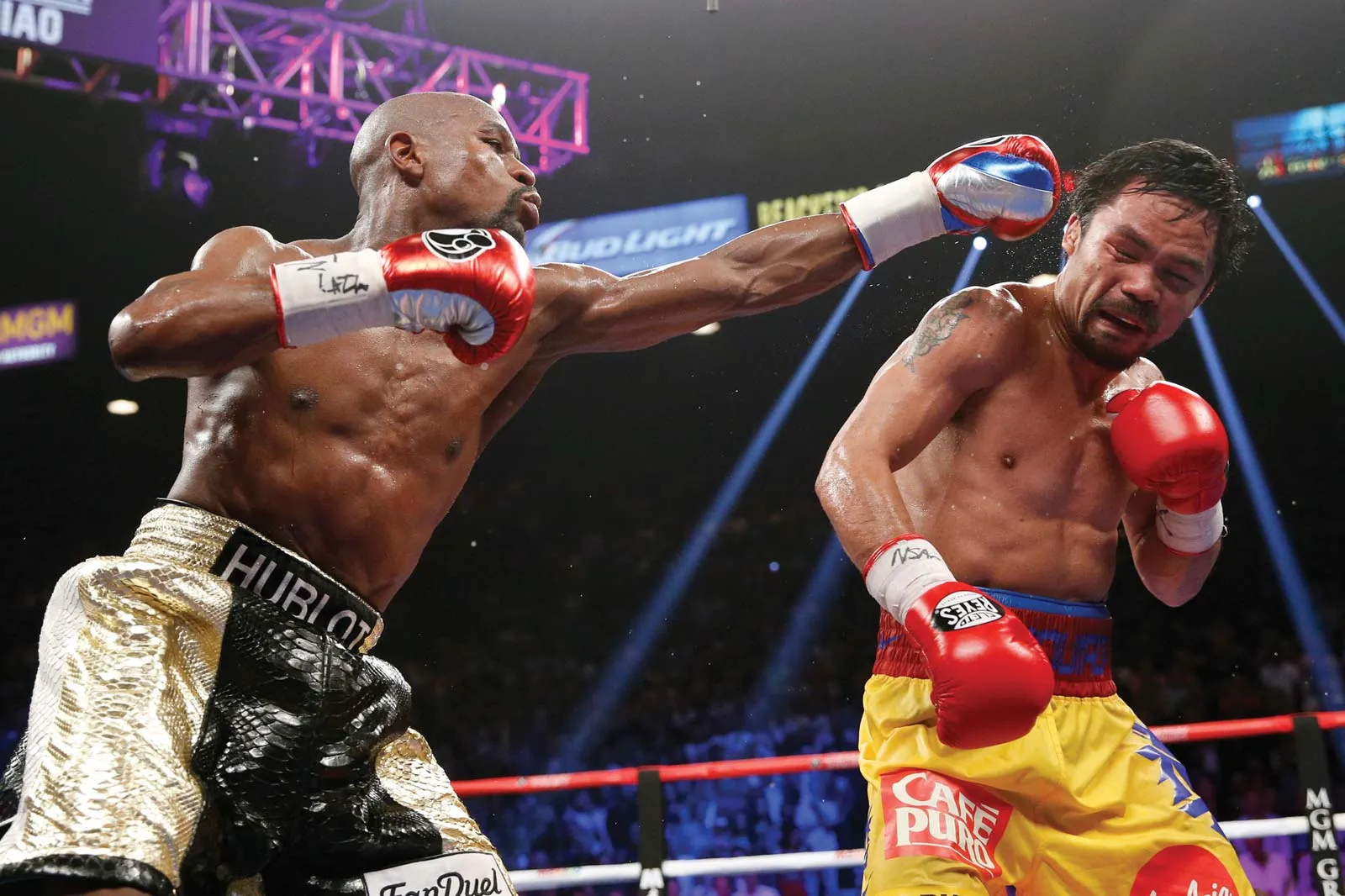 Floyd Mayweather flings a jab at Manny Pacquiao during their historic May 2, 2015 meeting at MGM Grand Garden Arena in Las Vegas, Nevada.