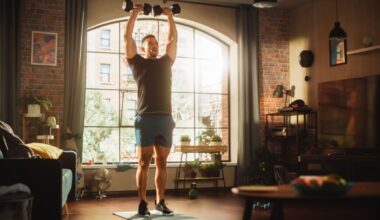 man doing dumbbell workout at home