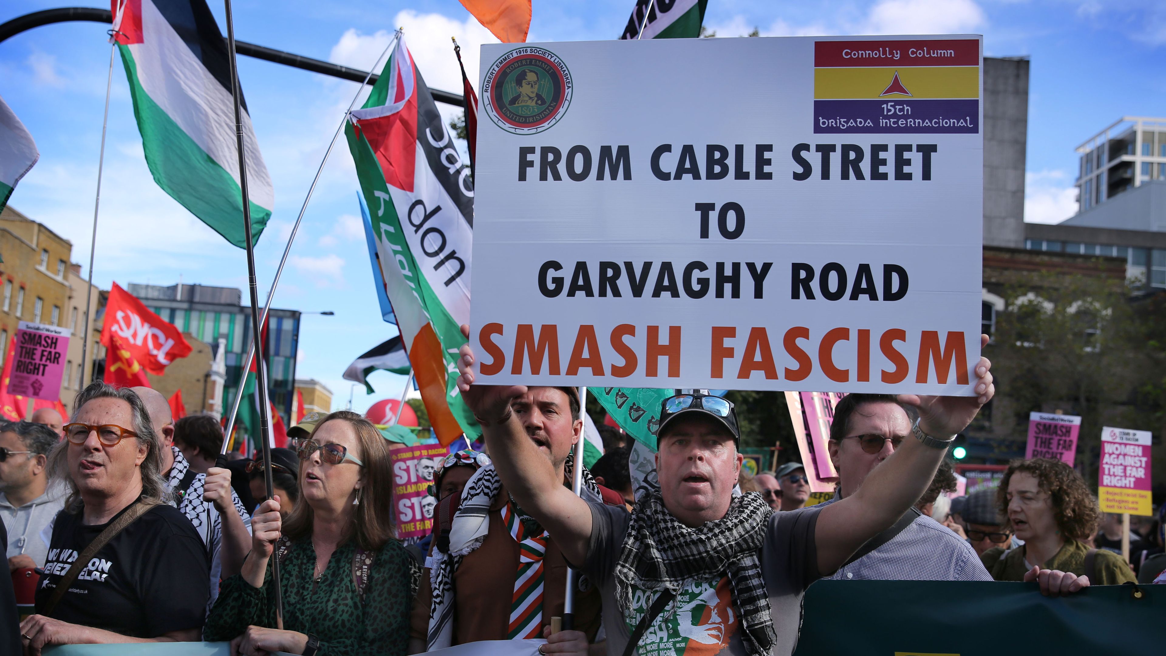 An Irish Republican supporter seen holding a sign saying 'From Cable Street To Garvaghy Road, Smash Fascism' during a rally. The 90th anniversary of the Battle of Cable Street was commemorated on Oct. 4, in the east end of London, while Garvaghy Road in Portadown, Northern Ireland is the site of a recent dispute involving unionists and Irish Republicans.  | Credit: Martin Pope/SOPA Images/LightRocket via Getty Images