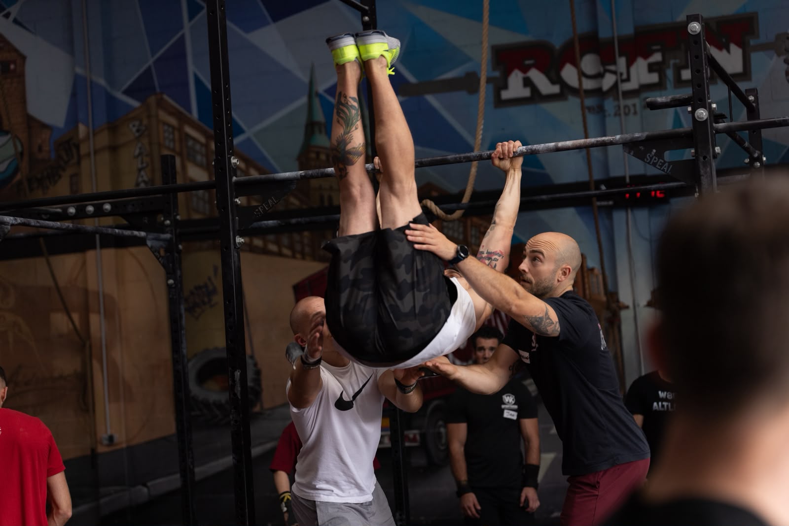 Gymnastics coach Barney Linssen coaching a group class