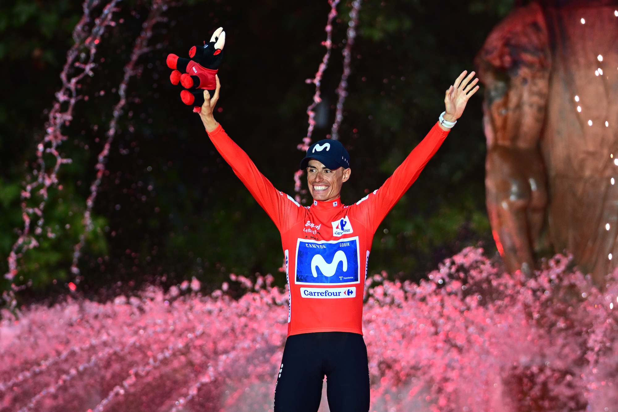 Enric Mas of Spain and Movistar Team celebrates at podium as Red Leader Jersey winner during the La Vuelta
