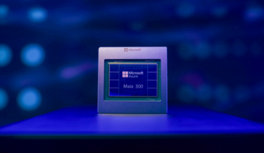 Microsoft Azure Maia 300 chip displayed against a dark blue background, illuminated by blue and purple light.