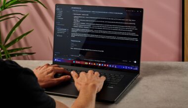 A man types into the Hermes hybrid AI agent app on the Asus ProArt P16 RTX Spark laptop.
