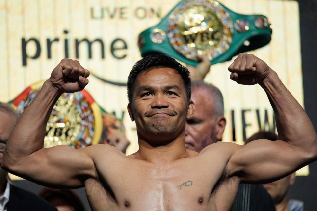 FILE - Manny Pacquiao poses on the scale during a ceremonial weigh in July 18, 2025, in Las Vegas. (AP Photo/John Locher, File)