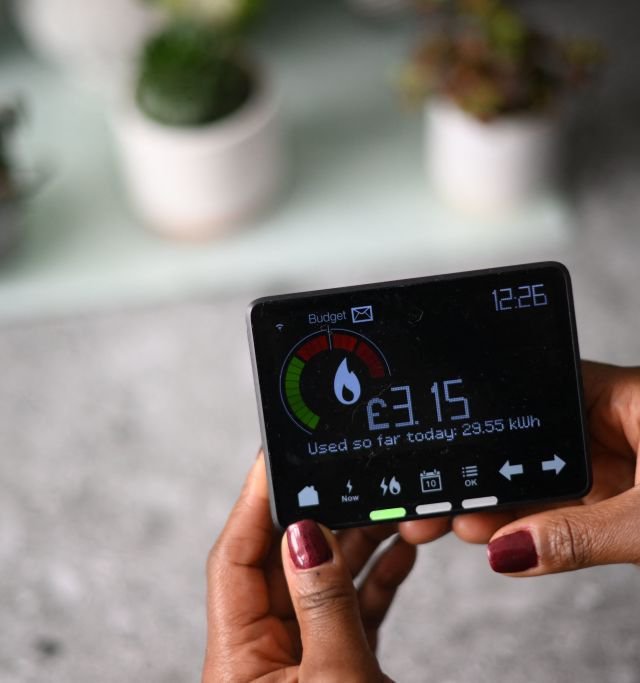 (FILES) A smart meter indicating how many kWh (kilowatt-hour) of energy has been used already in one day, and how much it has cost in pounds sterling, is pictured in a house in London, on December 13, 2022. The price cap on energy bills for most UK households will rise this winter, regulator Ofgem said on November 23, 2023, further fuelling a cost-of-living crisis that is forecast to worsen. Bills will climb from January on rising wholesale energy prices, which have increased due to key producer Russia's war in Ukraine, Ofgem said in a statement. (Photo by Daniel LEAL / AFP) (Photo by DANIEL LEAL/AFP via Getty Images)