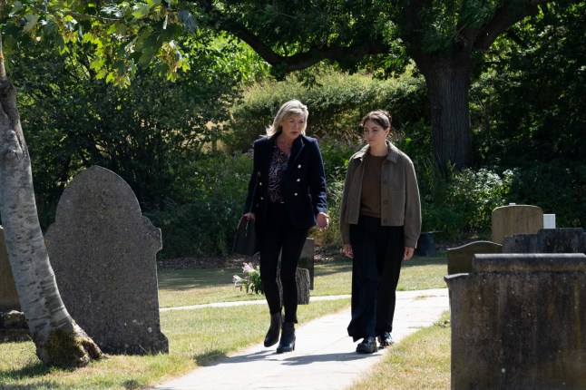 Kim and Thea chat while walking through the graveyard in Emmerdale