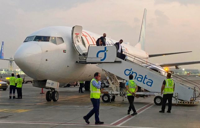 FILE - Israeli tourists leave a FlyDubai plane which departed from Ben-Gurion International Airport in Tel Aviv and landed in Dubai, United Arab Emirates, Nov. 8, 2020.(AP Photo/Malak Harb, File)