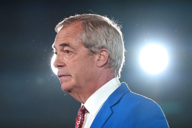 DONCASTER, ENGLAND - OCTOBER 01: Reform UK Leader Nigel Farage speaks during a Reform UK rally at Doncaster Race Course on October 01, 2026 in Doncaster, England. Reform UK Leader Nigel Farage is visiting Doncaster for a rally to announce his party's pledges for its first 100 days in government, if voted into power in the next general election. (Photo by Christopher Furlong/Getty Images)