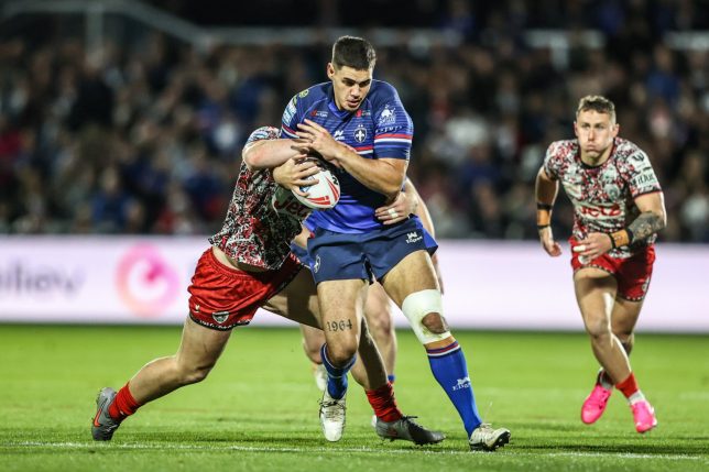 Caleb Hamlin-Uele of Wakefield Trinity is tackled by Jack Hughes of Leigh Leopards during the Betfred Super League Play-off Eliminator round match between Wakefield Trinity and Leigh Leopards at DIY Kitchens Stadium in Wakefield, United Kingdom, on September 18, 2026. (Photo by Alfie Cosgrove/News Images/NurPhoto via Getty Images)
