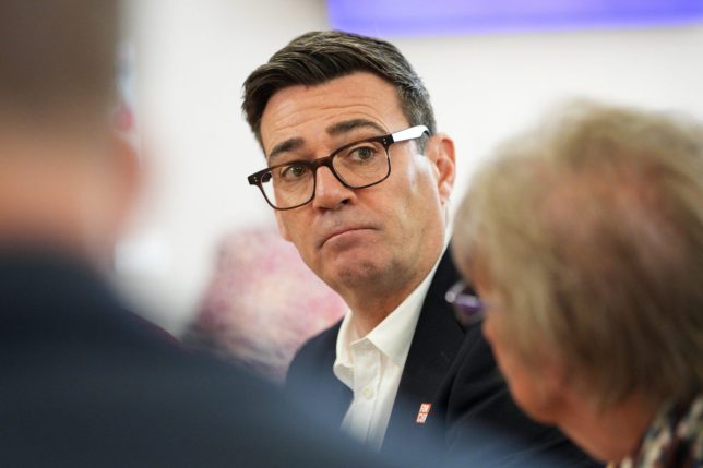 Britain's Andy Burnham looks on during a visit to the Humphrey Booth Resource Centre in Manchester, central England on October 9, 2026. (Photo by Christopher Furlong / POOL / AFP via Getty Images)