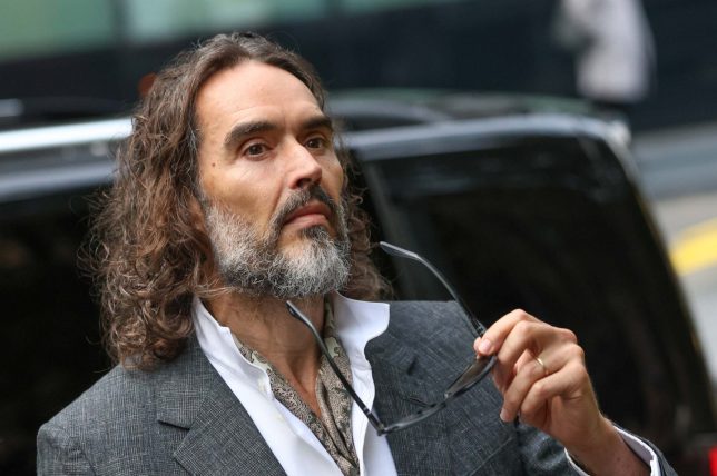 LONDON, UNITED KINGDOM - OCTOBER 12: Russell Brand, accompanied by his wife Laura Brand (not seen), arrives at Southwark Crown Court in London, United Kingdom, for a preliminary hearing over rape and sexual assault charges against him, on October 12, 2026. (Photo by Zeynep Demir/Anadolu via Getty Images)