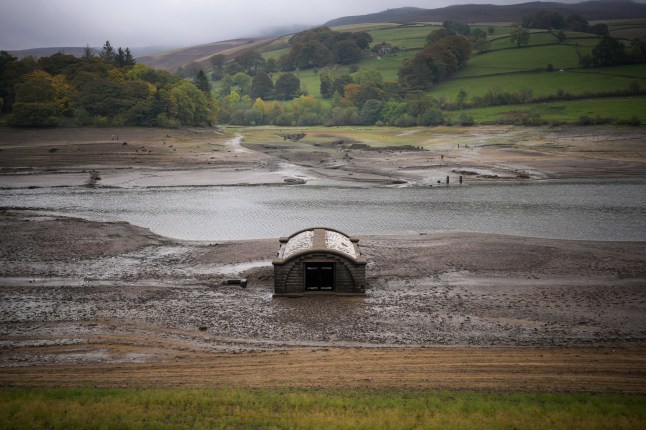 BAMFORD, UNITED KINGDOM - OCTOBER 19: The exposed pump house which provided water to Derwent Village, flooded in the 1940s to provide drinking water for the East Midlands and Sheffield, revealed due to the low water level at Ladybower Reservoir and drought conditions on October 19, 2026 in Bamford, United Kingdom. England is experiencing widespread drought conditions following a record-hot summer and the driest April-to-September period in over a century. Overall, roughly 82% of England remains in drought, 18 reservoir groups are less than half full, and temporary use restrictions remain active across large regions, requiring significant autumn and winter rainfall to replenish severely depleted groundwater and reservoir storage. (Photo by Christopher Furlong/Getty Images)