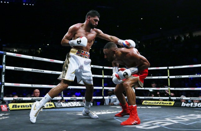 MANCHESTER, ENGLAND - FEBRUARY 19: Amir Khan (left) punches Kell Brook during their Welterweight contest at AO Arena on February 19, 2022 in Manchester, England. (Photo by Nigel Roddis/Getty Images)
