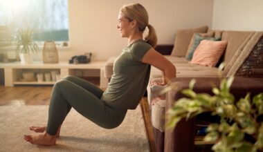Woman doing exercise in living room in sunshine