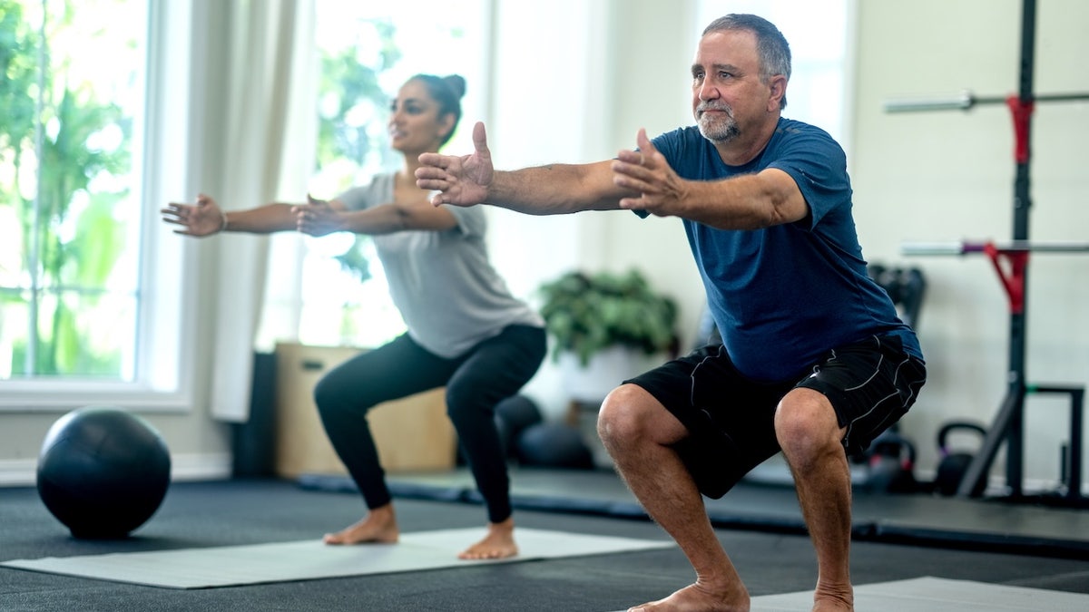 Adults squatting