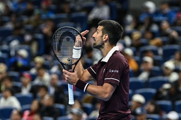 Serbia's Novak Djokovic reacts during his men’s singles quarter-final match against Germany’s Alexander Zverev at the China Open tennis tournament in Beijing on October 4, 2026.