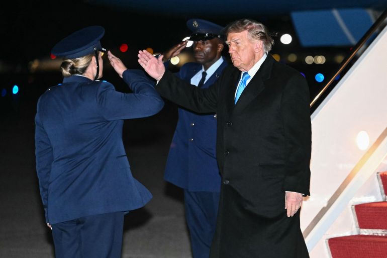 US President Donald Trump returns a salute upon disembarking from Air Force One at Joint Base Andrews, Maryland, on October 5, 2026.