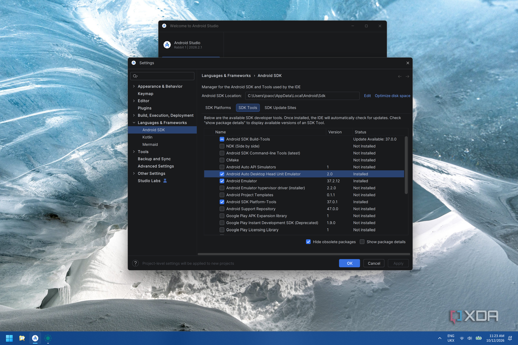 Screenshot of Android Studio showing a list of SDK Tools available. The Android Auto Desktop Head Unit Emulator is selected and installed