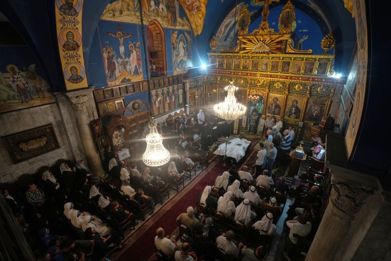 Mourners attend the funeral of Palestinians Maisaa Abu Dawood and her daughter Mary, who were killed in an early morning Israeli airstrike, at the Church of St. Porphyrius in Gaza City, Saturday, Oct. 3, 2026. (AP Photo/Jehad Alshrafi)
