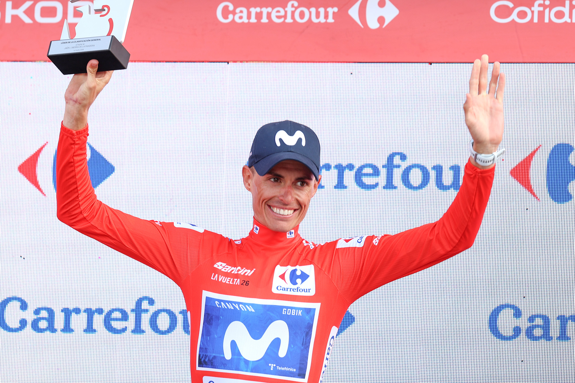 Enric Mas celebrates in the red jersey as Vuelta a Espa&ntilde;a leader after stage 14 of the 2026 race