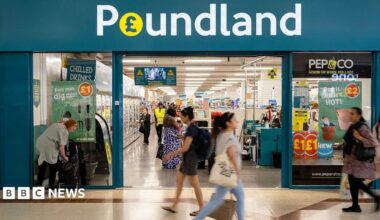 Exterior shot of a Poundland store with people walking past it