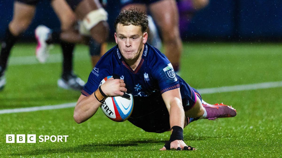 Edinburgh scrum-half Hector Patterson dives over the line to score a try against Lions in the United Rugby Championship