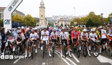 Riders at the Giro di Lombardia stage a protest prior to the start of the race