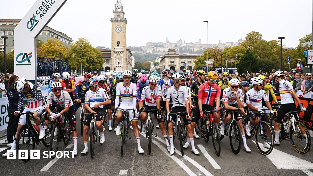 Riders at the Giro di Lombardia stage a protest prior to the start of the race