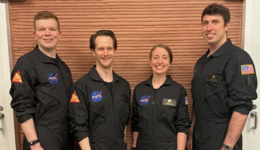 Members of NASA’s CHAPEA (Crew Health and Performance Exploration Analog) Mission 2 crew stands in their workspace after spending a year in their isolated and confined habitat at NASA’s Johnson Space Center in Houston. (from left: James Spicer, Matthew Montgomery, Ellen Ellis, and Ross Elder). Credit: NASA