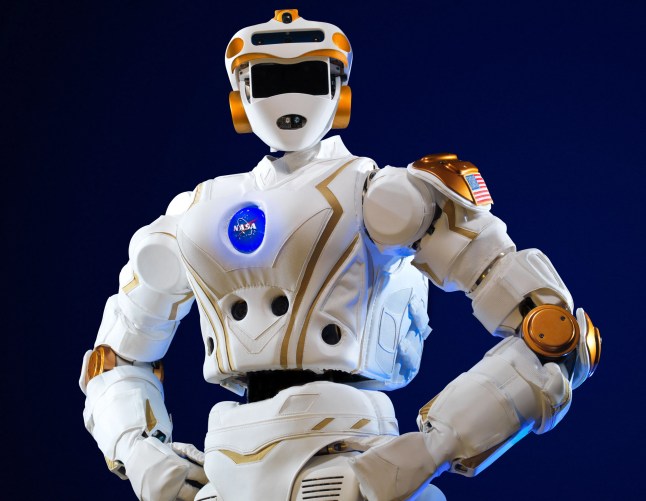 A robot standing with its arms at its sides with a blue Nasa logo at its chest. (Picture: NASA/Cover Images)