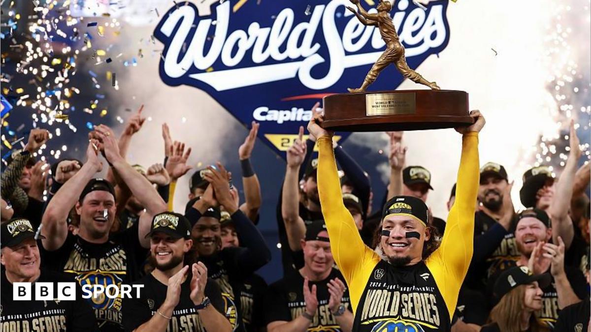 William Contreras lifts the Willie Mays World Series Most Valuable Player award after the Milwaukee Brewers beat the Tampa Bay Rays in game five to clinch the 2026 World Series